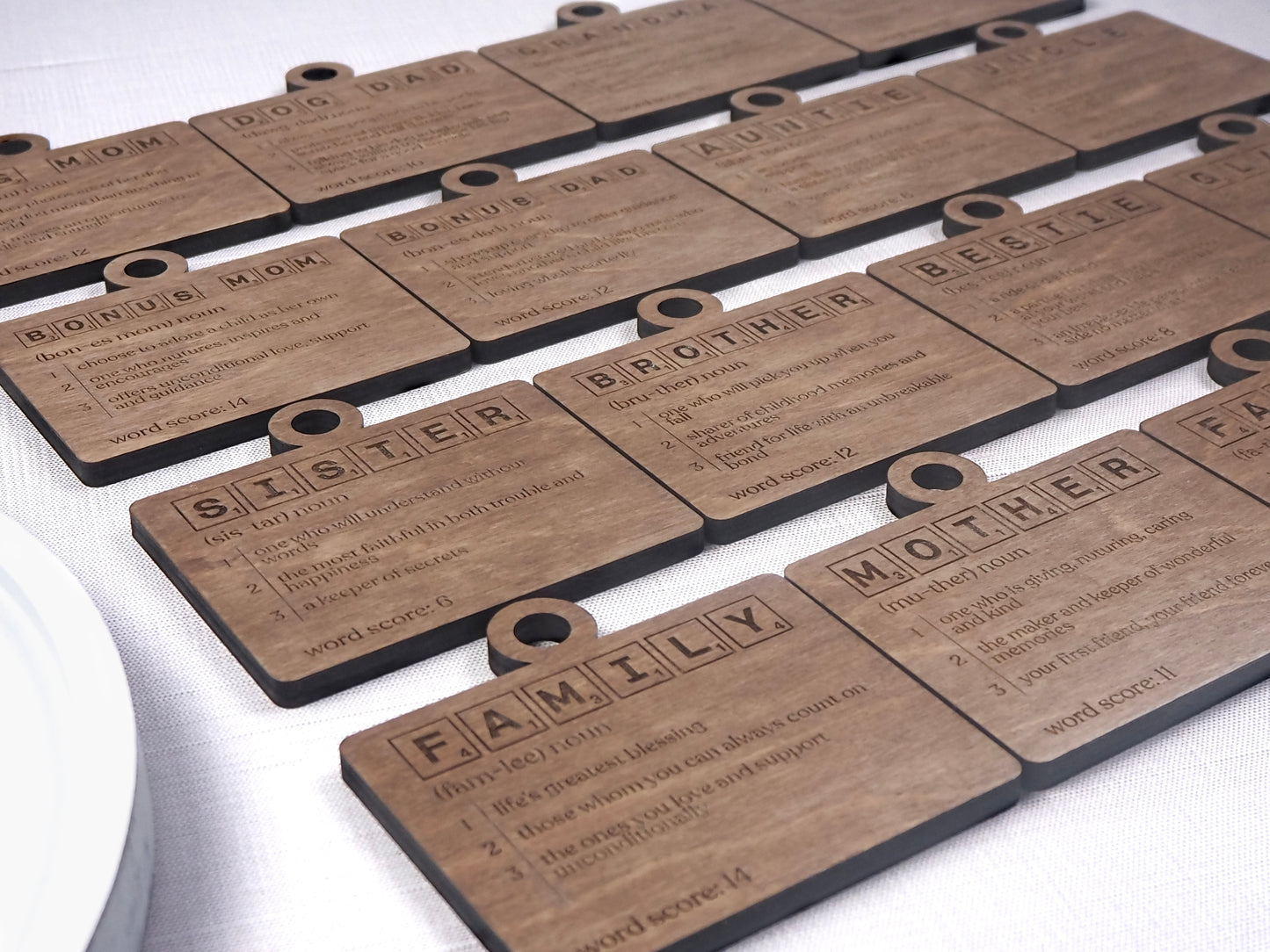 Handcrafted wooden Definition Word Tile Ornaments featuring letter tile motifs and heartfelt definitions for family members and loved ones, perfect for holiday décor.