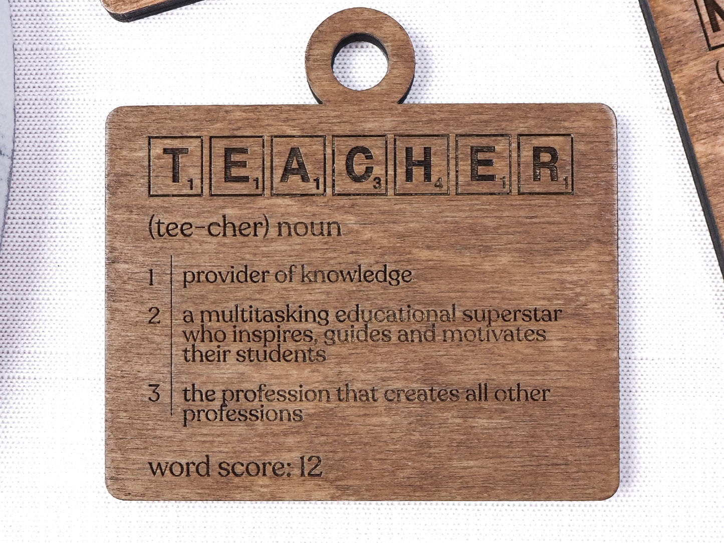 Handcrafted wooden Teacher Definition Word Tile Ornament featuring letter tile motifs and a heartfelt definition, perfect for holiday décor and teacher gifts.