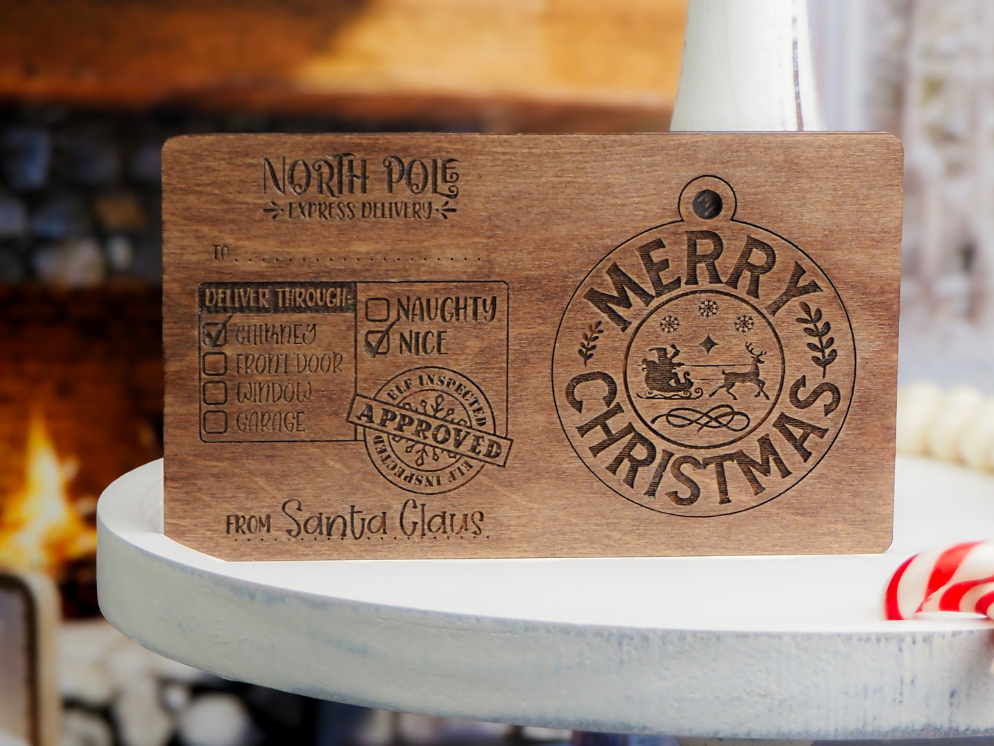 Handcrafted wooden North Pole Express Delivery Postcard Ornament featuring Santa's delivery tag design with "Naughty or Nice" checklist and "Merry Christmas" engraving, perfect for holiday décor.