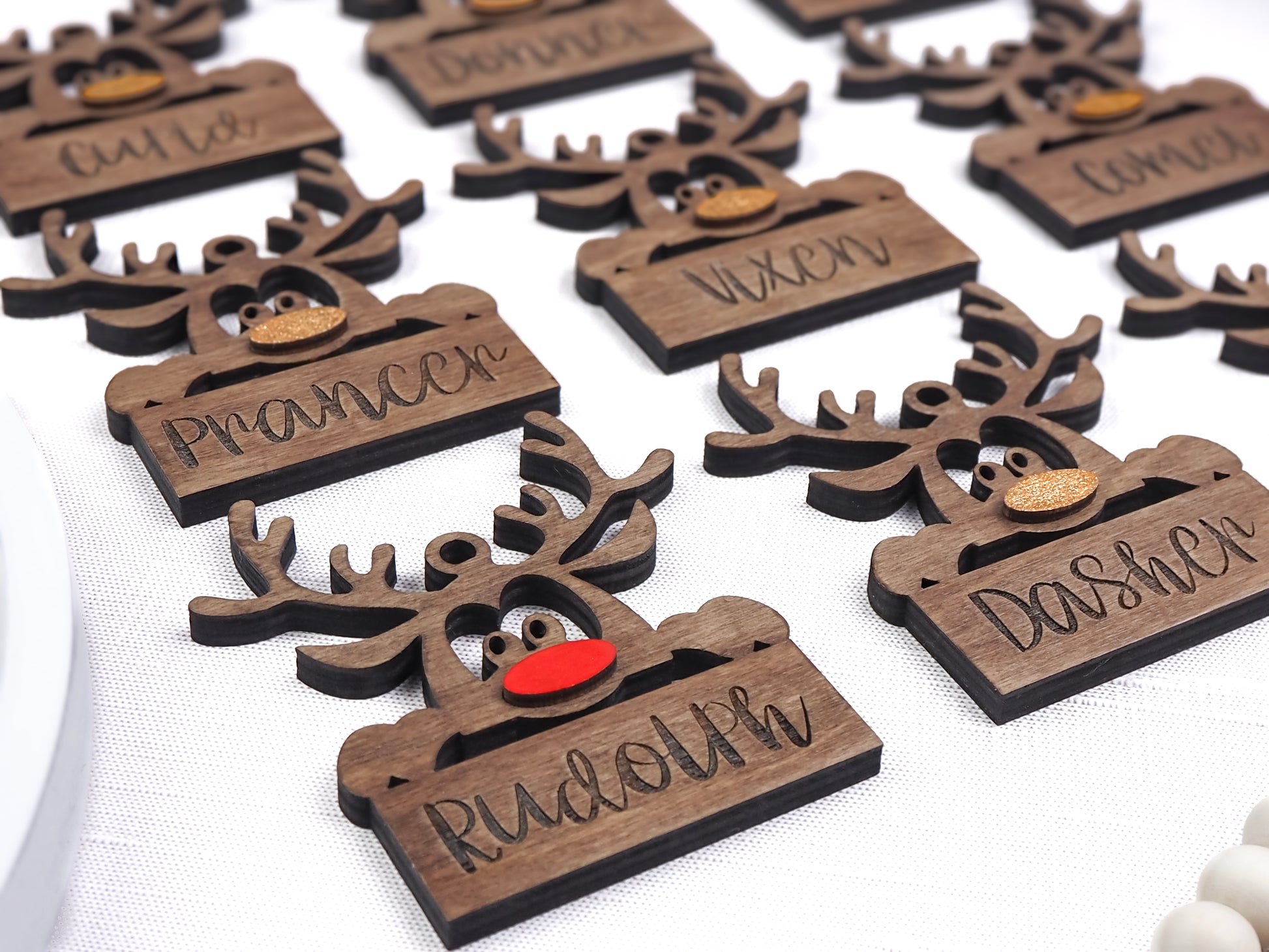 Handcrafted wooden Reindeer Name Tag Ornaments Set featuring Santa’s reindeer names and playful designs, perfect for holiday décor and gift-giving.