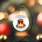 Round white ornament hanging from a black metal stand, featuring the phrase "Coffee Bean O Coffee Bean" at the top and "How lovely is your caffeine" at the bottom. The design includes a burlap sack filled with coffee beans, decorated with a red bow. Holiday ornaments are placed nearby.