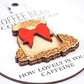 Close-up of a white round ornament featuring the text in black "Coffee Bean O Coffee Bean" at the top and "How lovely is your caffeine" at the bottom. The design includes a raised burlap sack with a red bow and intricate wood detailing of coffee beans.