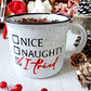 Campfire white ceramic mug with speckles and a black halo around the rim. The words Nice, Naughty and I tired are hand-painted with a check mark beside I tried is on one side. Nice and Naughty is painted in black and the checkmark and I tried is painted in red. The Nice, Naughty and I tried is hand-painted by Snuggle Up Co.