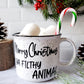 Campfire white ceramic mug with speckles and a black halo around the rim. The words Merry Christmas Ya Filthy Animal are hand-painted in black is on one side. The Merry Christmas Ya Filthy Animal is hand-painted by Snuggle Up Co.