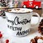 Campfire white ceramic mug with speckles and a black halo around the rim. The words Merry Christmas Ya Filthy Animal are hand-painted in black is on one side. The Merry Christmas Ya Filthy Animal is hand-painted by Snuggle Up Co.
